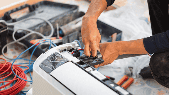 ALJ Heating & Cooling technician performing AC installation in Schenectady, NY